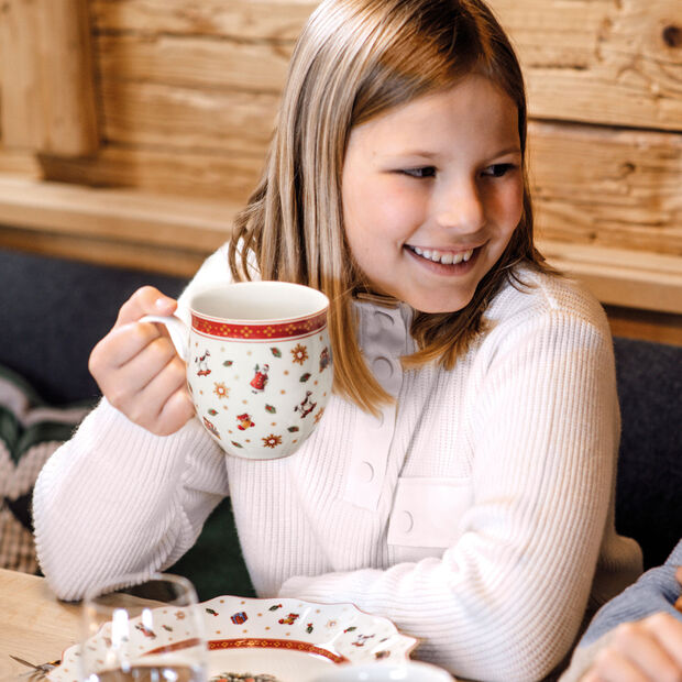 Toy's Delight coffee mug with scattered pattern