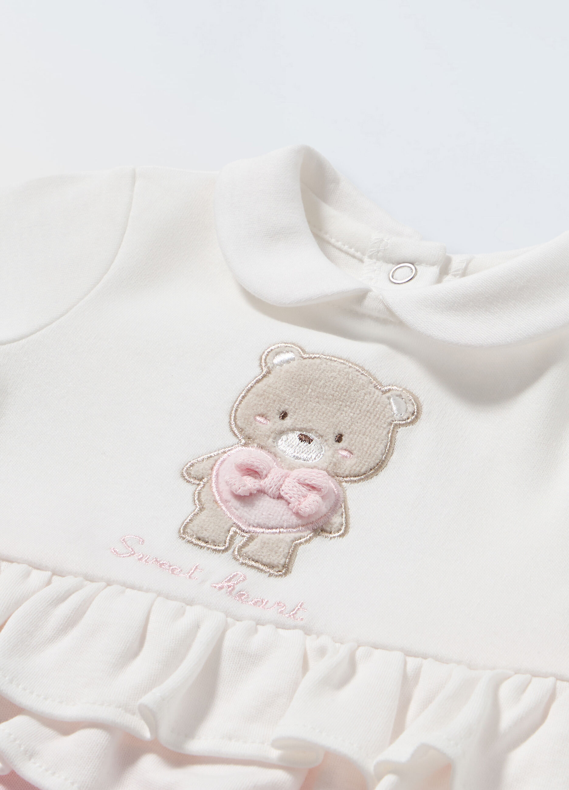 Tutina in puro cotone con rouches neonata